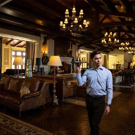 Waiter holding a tray in a room