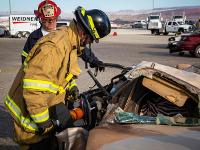 Firefighter using Hydraulic rescue tools