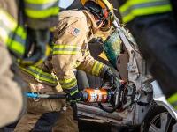 Firefighter using Hydraulic rescue tools