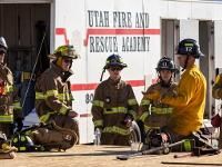 Firefighters in a group being instructed