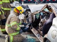 Firefighter using Hydraulic rescue tools