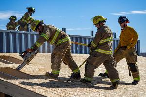 Firemen cutting a roof open