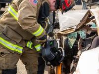 Firefighter using Hydraulic rescue tools