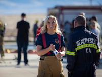 Firefighter walking with water bottle in hand