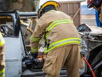 Firefighter using Hydraulic rescue tools