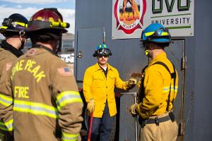 Firefighter instructing other firefighters