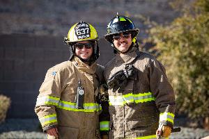 Two firefighters taking a picture together