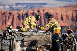 Firemen on their hands and knees