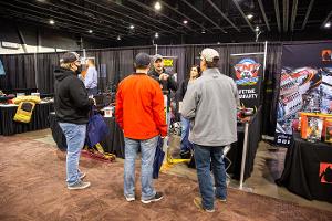 People Standing around a booth