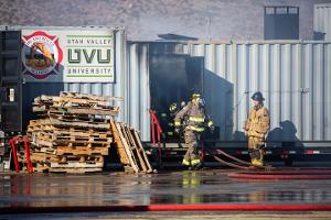 Firefighters leaving a smoking building