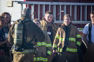 Firefighters being instructed