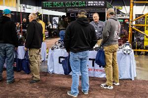 People Standing around a booth