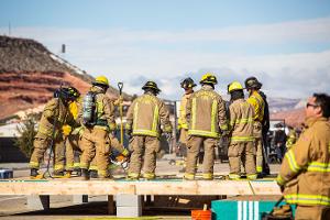 A group of firefighters listening to instruction