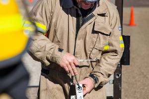 A firefighter instructing other firefighters