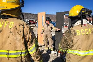 Firefighters training on a door.