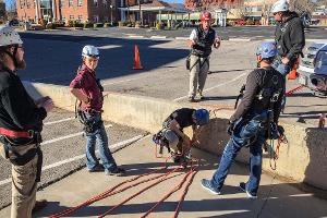 Firefighter putting on a harness