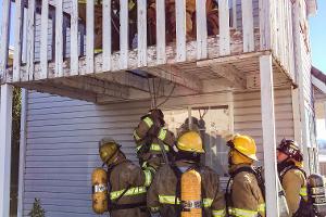 Firefighters at a house