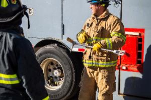 Firefighter instructing other firefighters