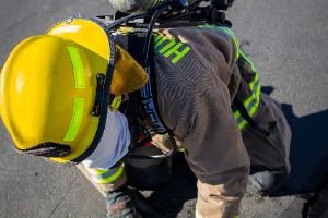 Firefighter holding a firehose