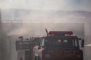 Fire truck surrounded by smoke