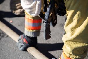 Firefighter holding a firehose