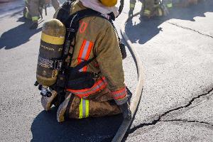 Firefighter holding a firehose