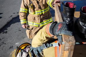 Two firefighters holding a firehose