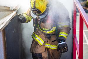 Firefighters in smoky building