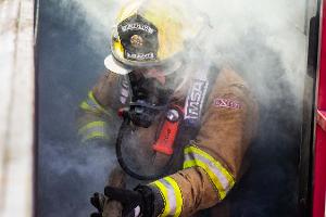 Firefighters in smoky building