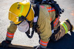 Firefighter holding a firehose