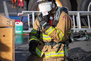 Firefighter using walkie-talkie