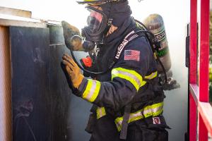 Firefighters in smoky building