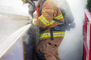 Firefighters in smoky building