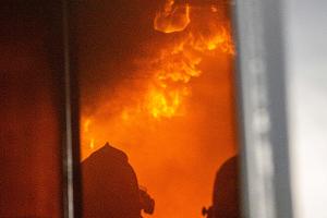 Two firefighters in a burning building