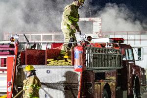 Firefighters on a firetruck