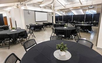 Skylight room with circular tables and chairs around the tables