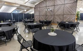 Skylight room with circular tables and chairs around the tables