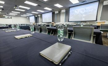 Conference Room with water bottles and rows of chairs