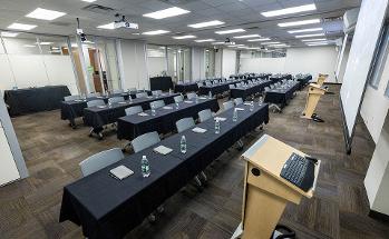 Conference Room with water bottles and rows of chairs