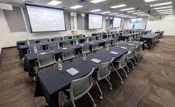 Conference Room with water bottles and rows of chairs