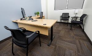 Office with a desk and chairs