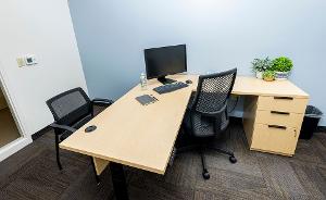 Office with a desk and chairs