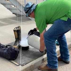 Dr. Halling preparing a sample for impact testing