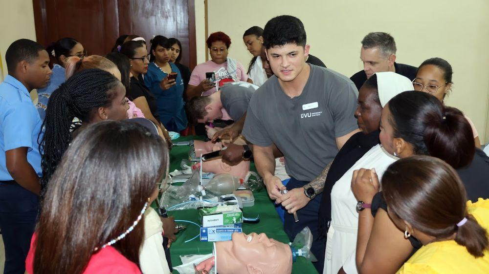 Students speaking to a teacher's instructions