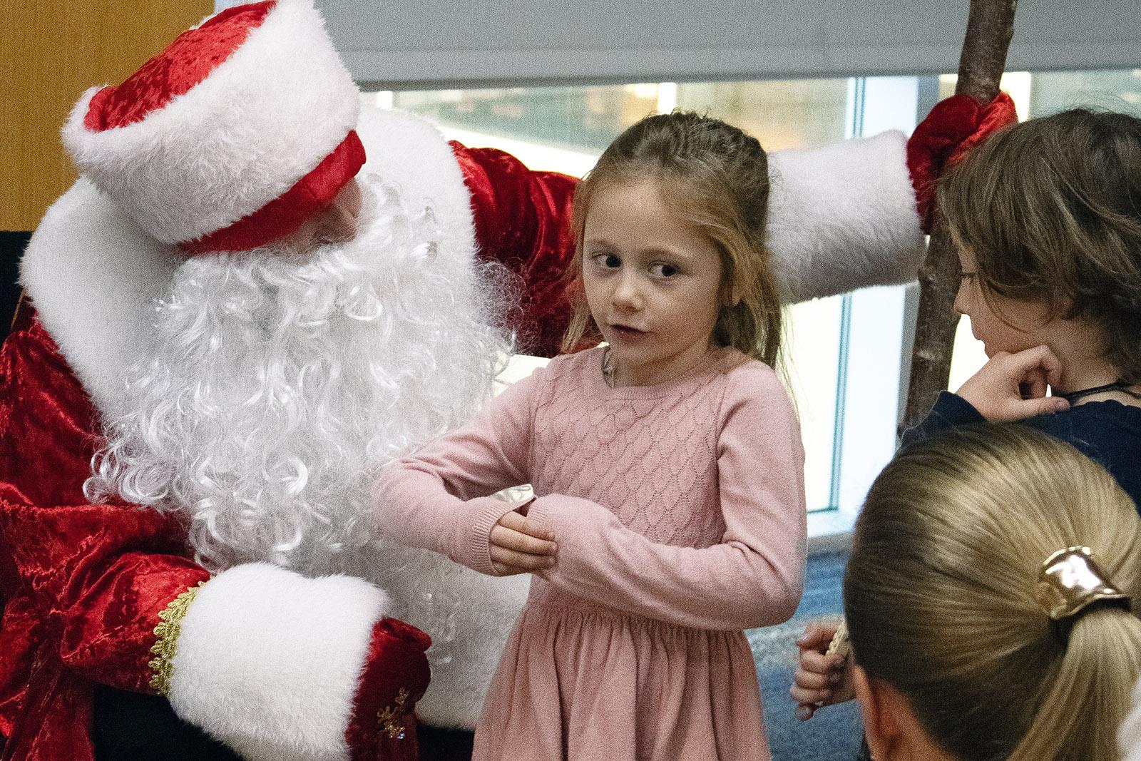 Ded Moroz listening to a child's wishes