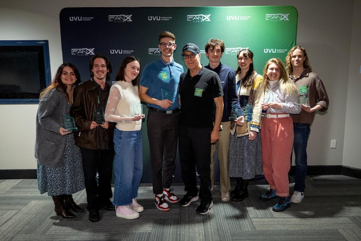 steven de souza poses with students