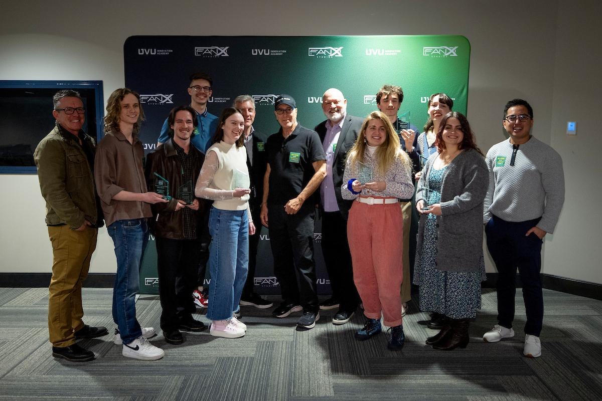 steven de souza poses with students