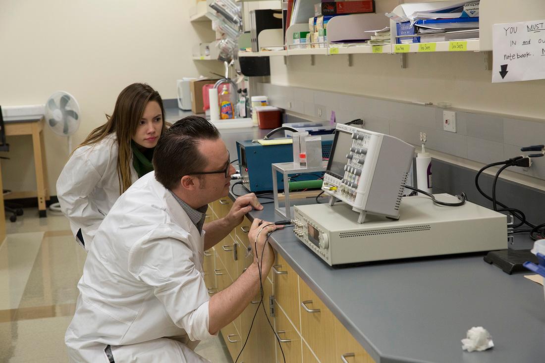 Brian Patchett and Natalie Sullivan work on acoustic research.