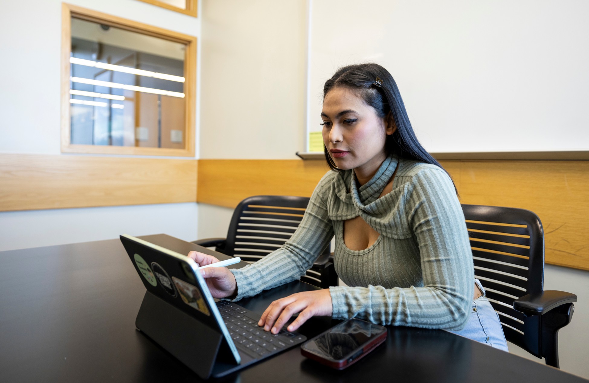 Woman studying in the library.