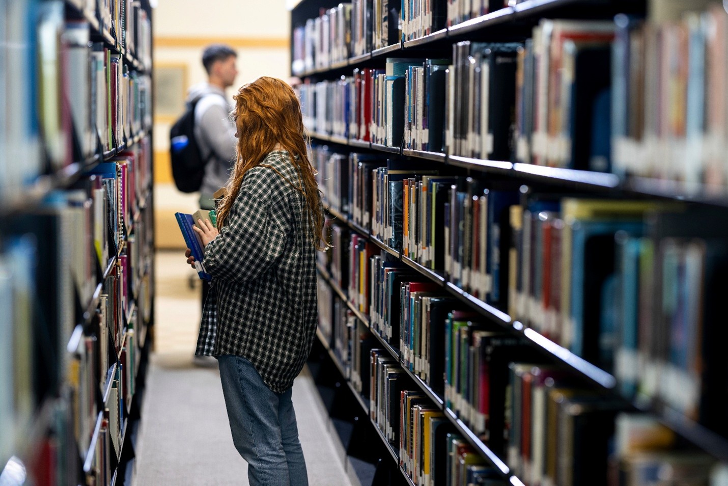 2025 blog streaming Students sitting in the grass at the library.